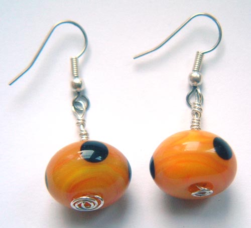 Yellow/orangey beads with black dots melted in